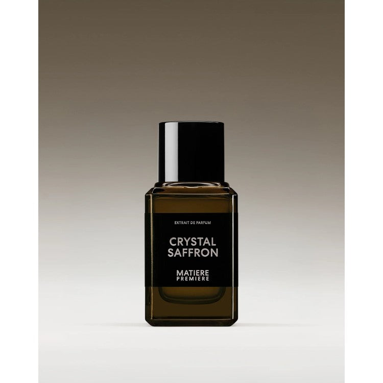 Perfume bottle labeled 'Crystal Saffron' by 'Matiere Premiere' on a gradient background