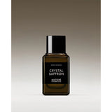 Perfume bottle labeled 'Crystal Saffron' by 'Matiere Premiere' on a gradient background